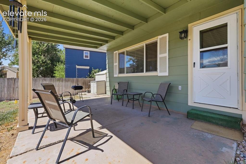 Image 5 of 43: Covered back patio.