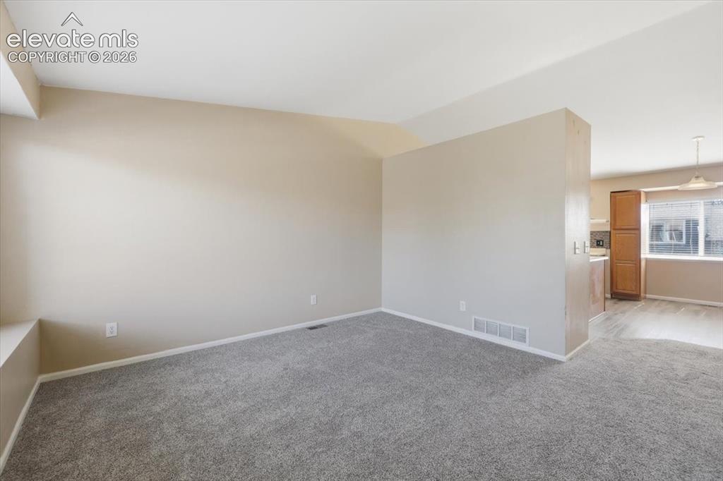 Image 8 of 43: Living room and dining area.
