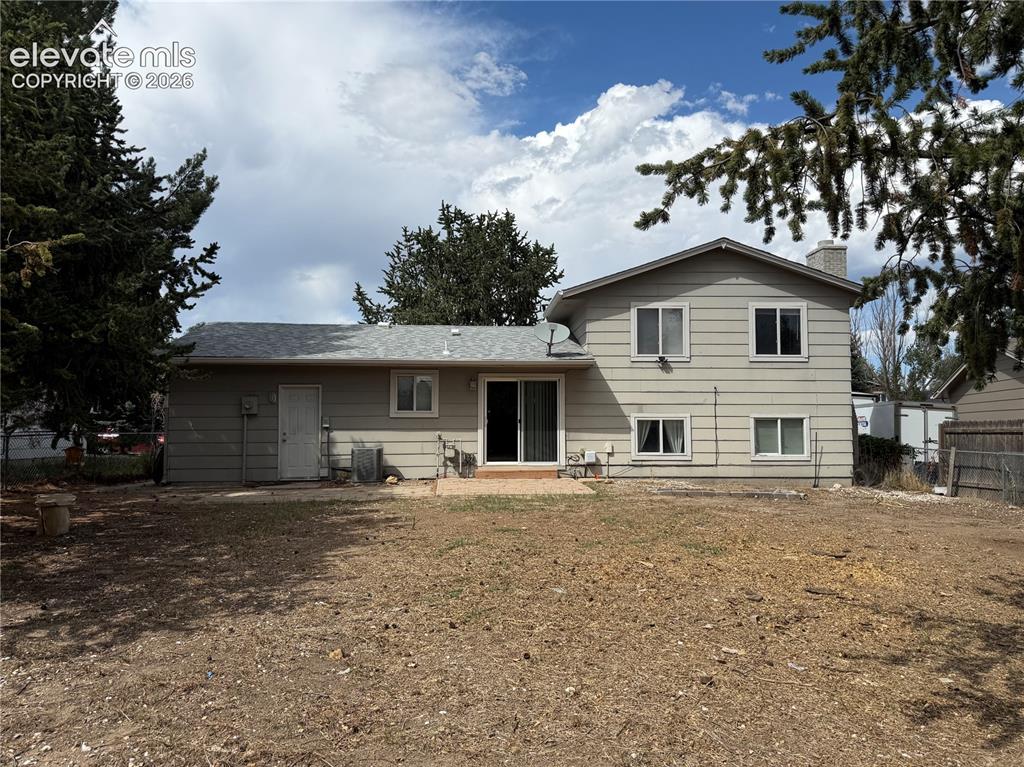 Image 17 of 17: Expansive backyard with a patio area and direct outdoor access through slid