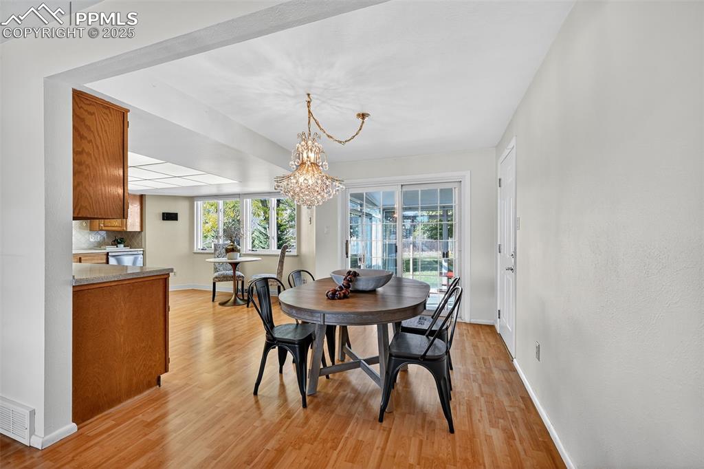 Image 17 of 40: Separate dining area walks out to the indoor/outdoor space!