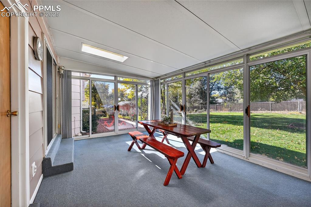 Image 19 of 40: Wonderful indoor outdoor space with 4 sliding doors for entertaining all ye