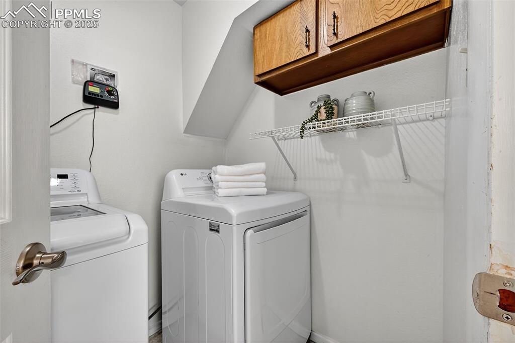 Image 33 of 40: Finished laundry room with cabinet!