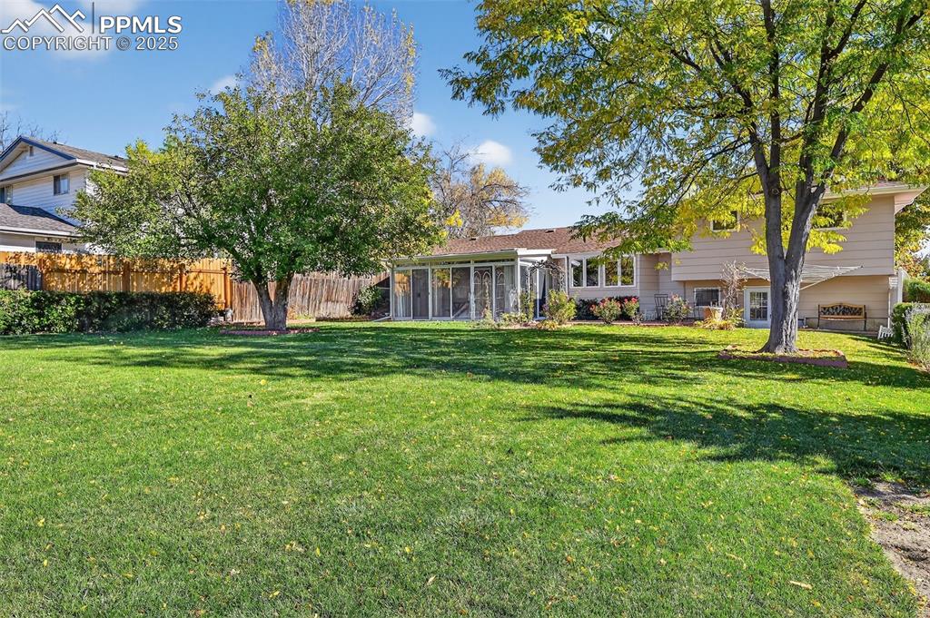 Image 35 of 40: Park like back yard with shade trees, patio and indoor/outdoor space!