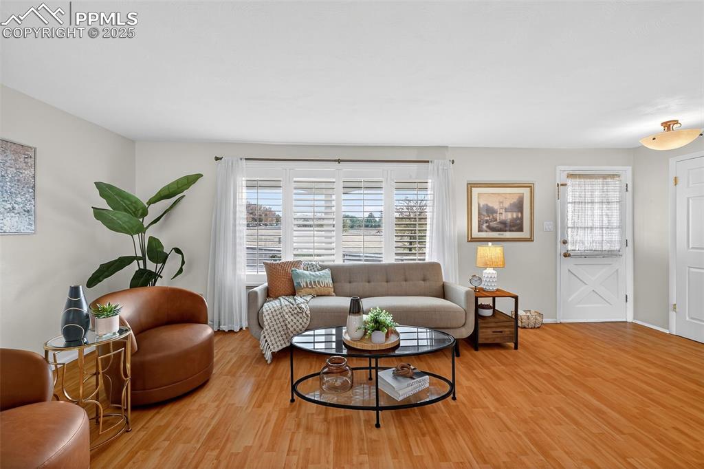 Image 7 of 40: Large family room with space for lots of furniture!  Curtains included!