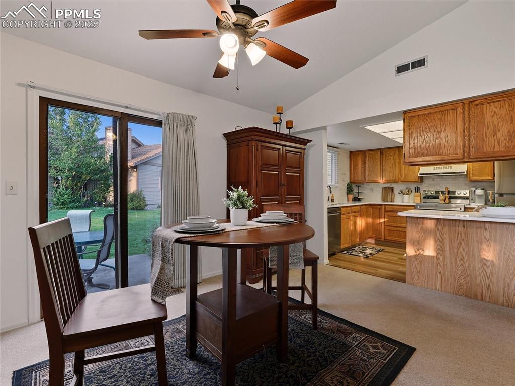 Image 10 of 36: Dining room features a convenient walk-out to a patio for al-fresco options