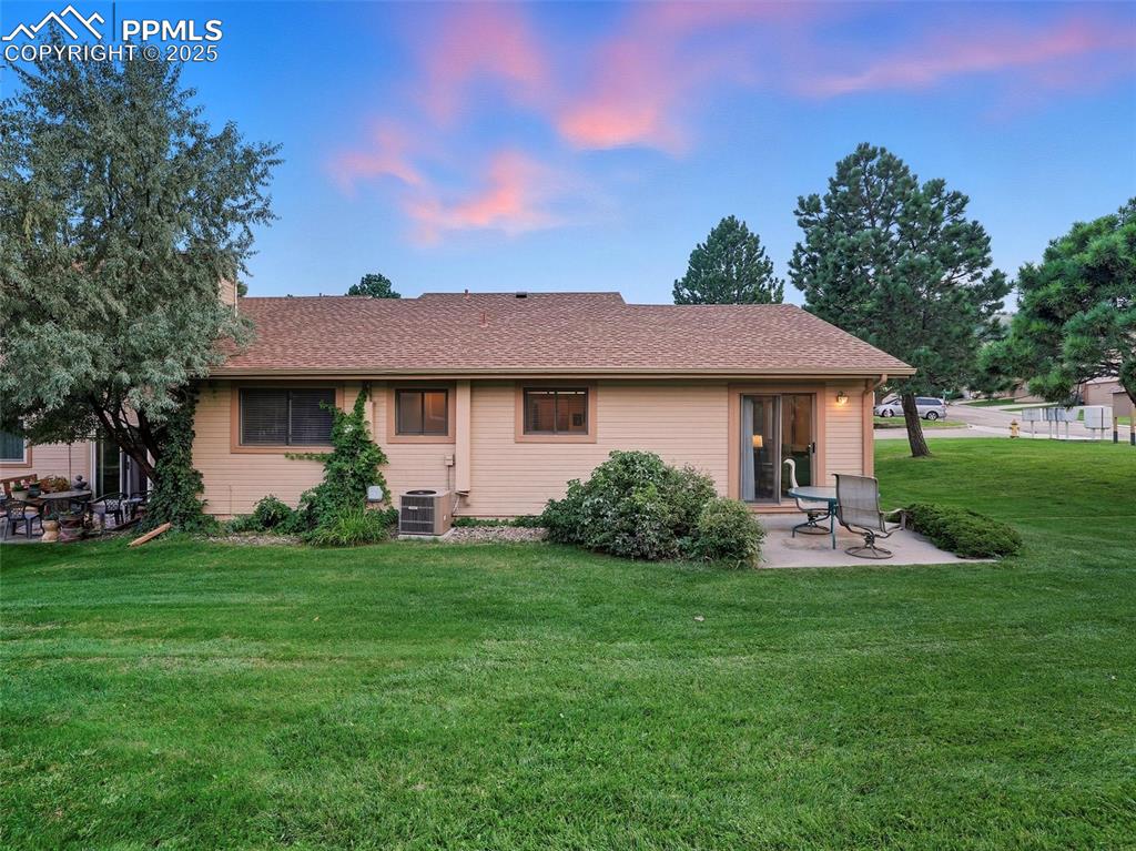 Image 12 of 36: Rear patio also provides space for a quiet morning coffee