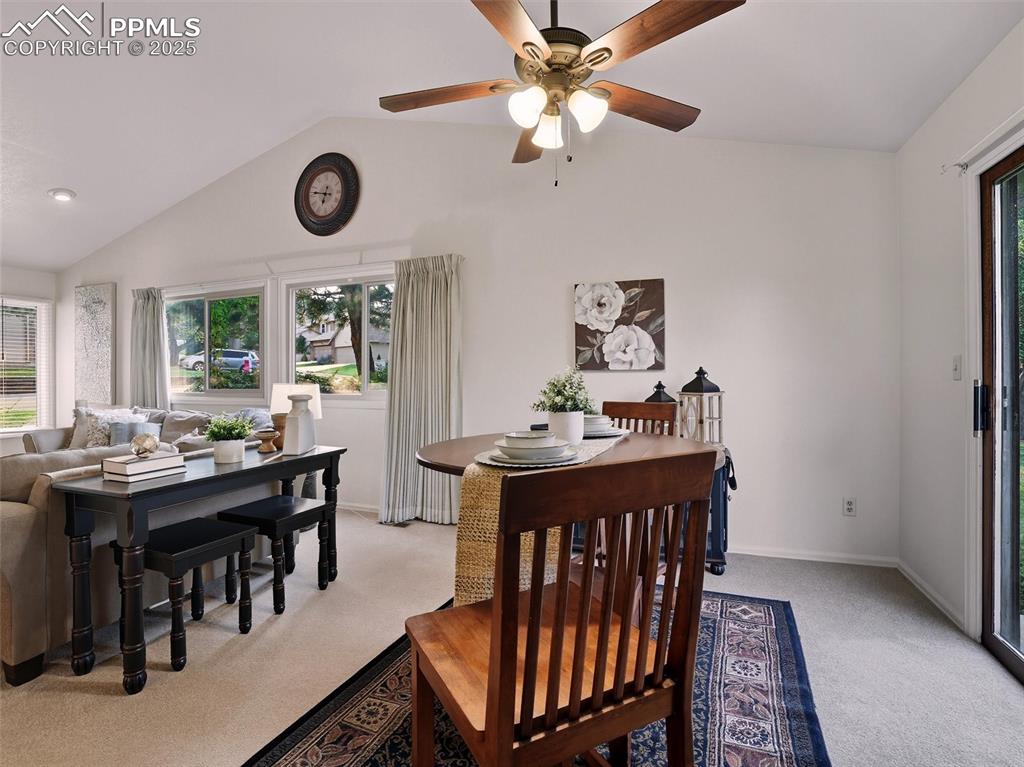 Image 16 of 36: Spacious dining room features a ceiling fan to accompany the central air-co