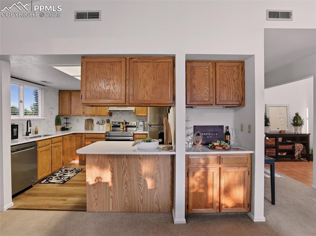 Image 17 of 36: Leading into the kitchen, you