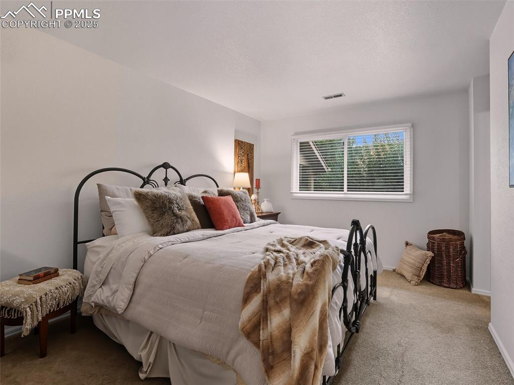 Image 23 of 36: Spacious primary bedroom with en-suite bath and walk-in closet