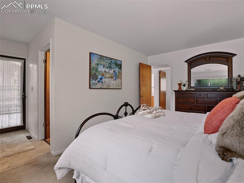 Image 24 of 36: Primary bedroom features private entrance from the covered courtyard.