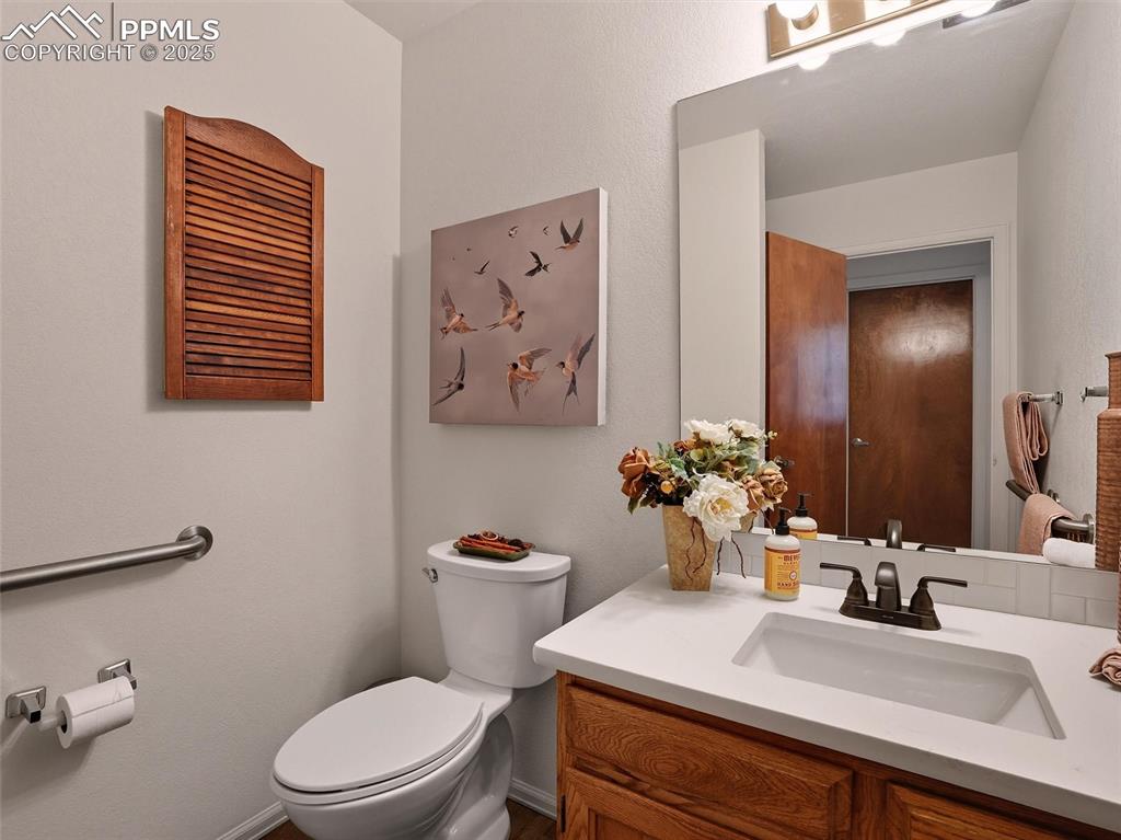 Image 25 of 36: En-suite primary 3/4 bathroom with updated quartz countertops