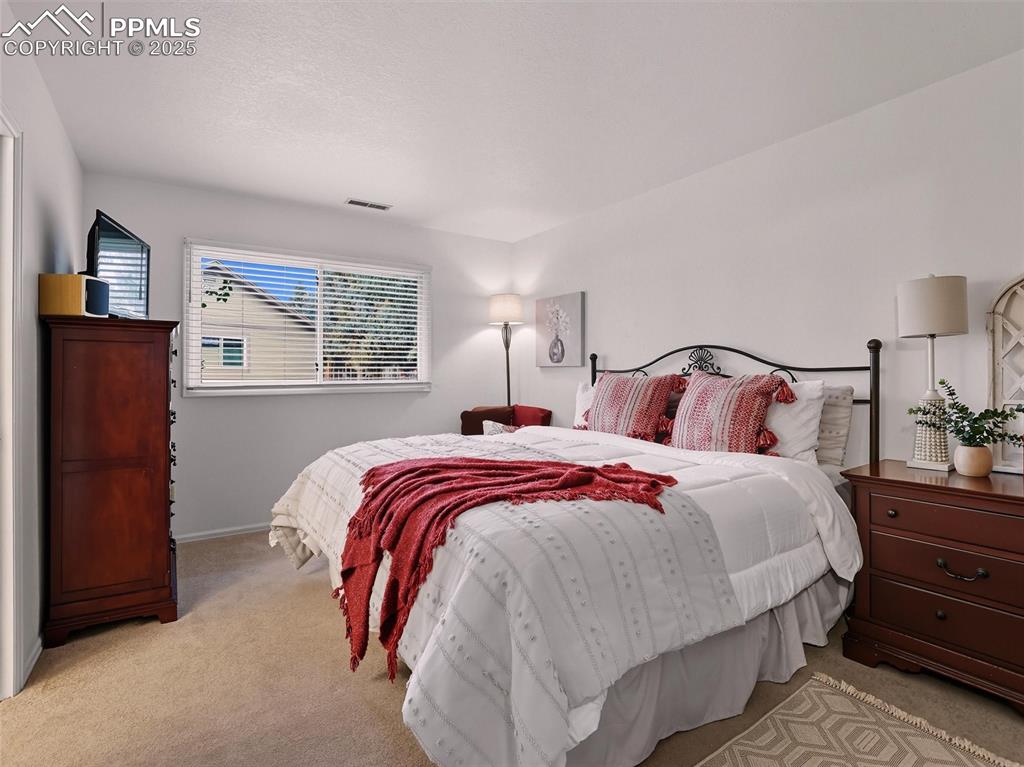 Image 28 of 36: Second bedroom also provides ample space, could be considered a second prim