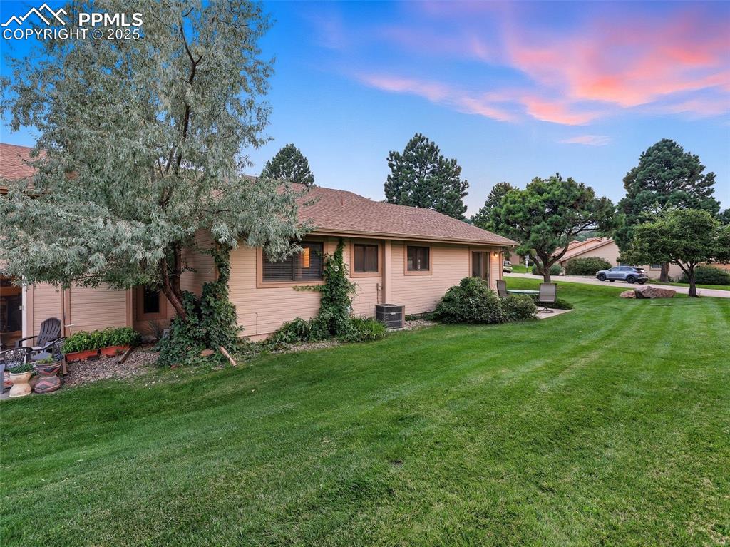 Image 32 of 36: Beautiful rear lawn with plenty of open space