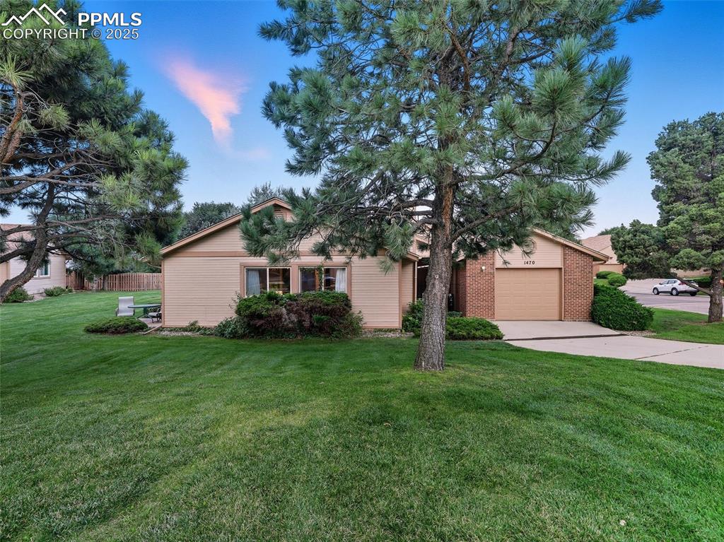 Image 34 of 36: Spacious lawn continues all the way the street corner, to the easily access