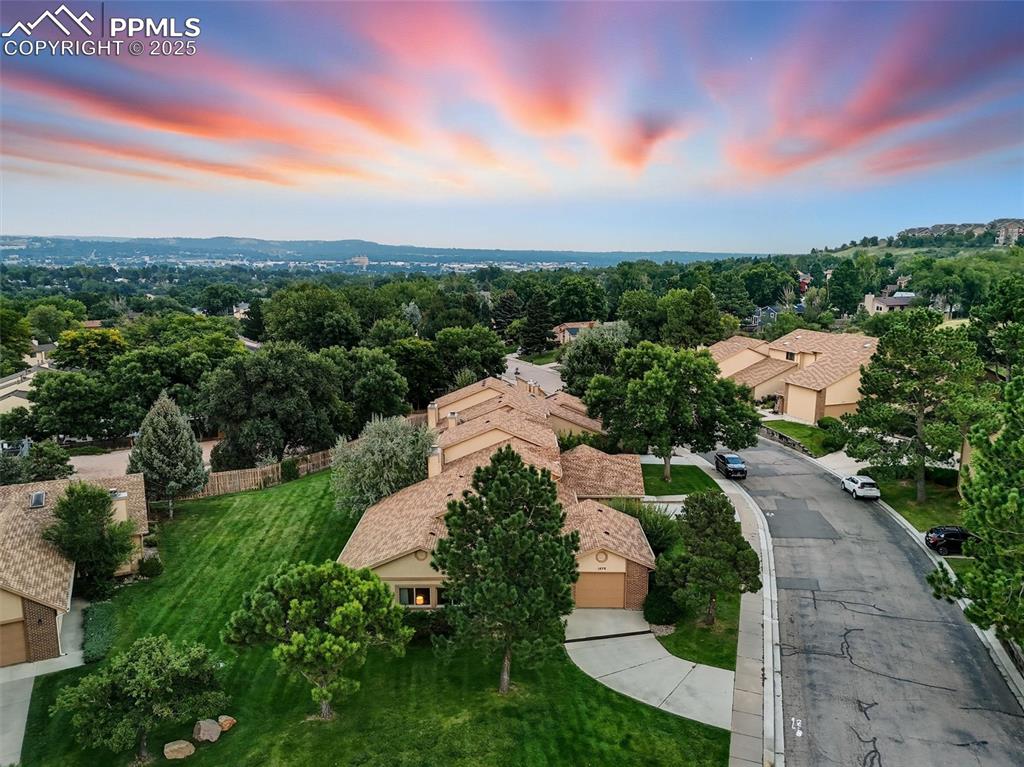 Image 36 of 36: Lovely private end unit in the complex with an aerial view of Colorado Spri