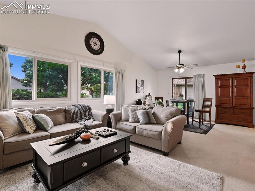 Image 9 of 36: Living room and dining room combine seamlessly in the open concept floorpla