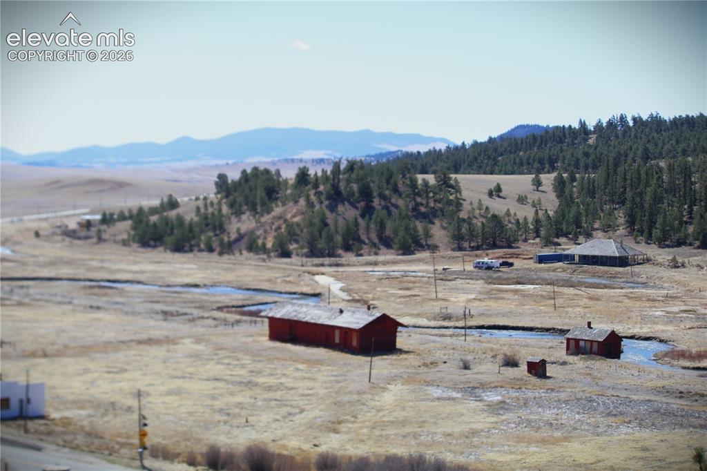 Image 8 of 15: View of the old hot springs, barn and the South Platte River