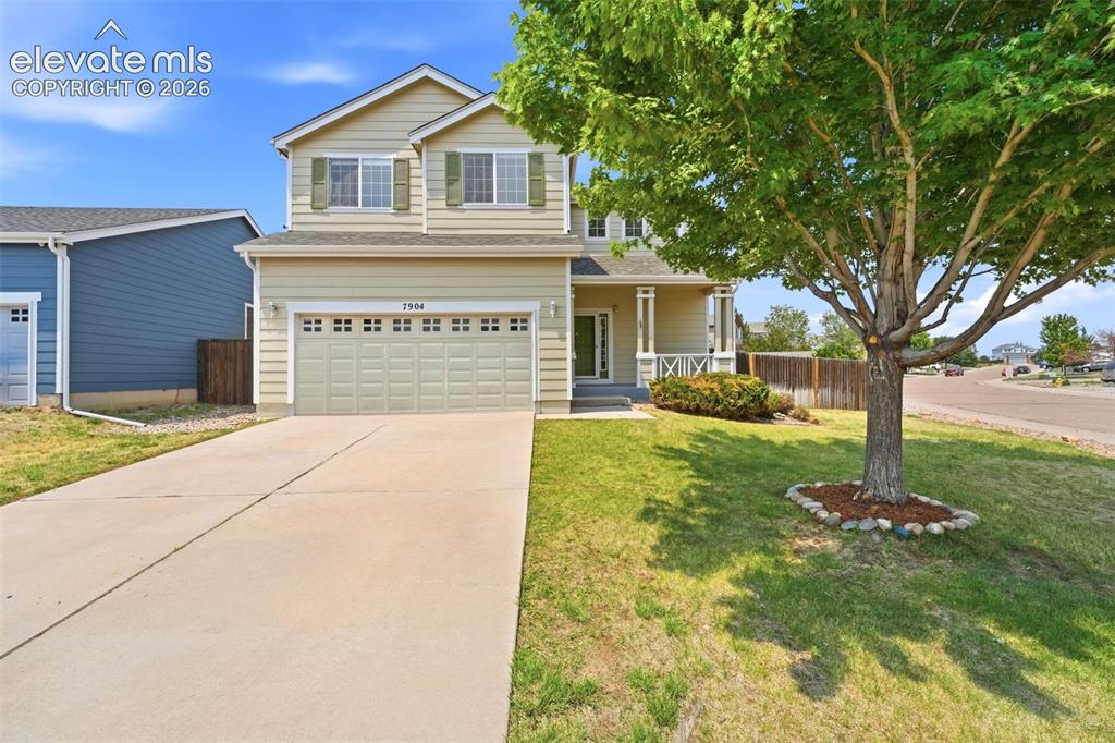 Image 1 of 48: Two-story residence featuring light-colored siding and green shutters