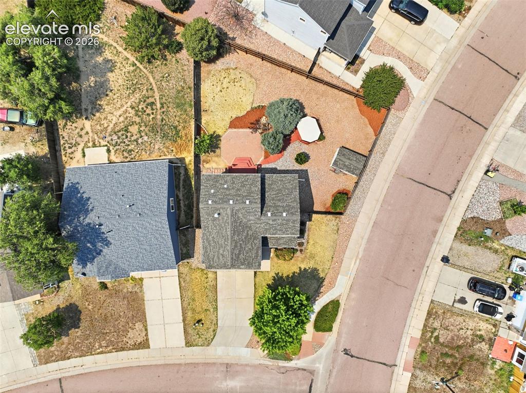Image 43 of 48: Aerial perspective showcasing a property with a multi-gabled roofline and a
