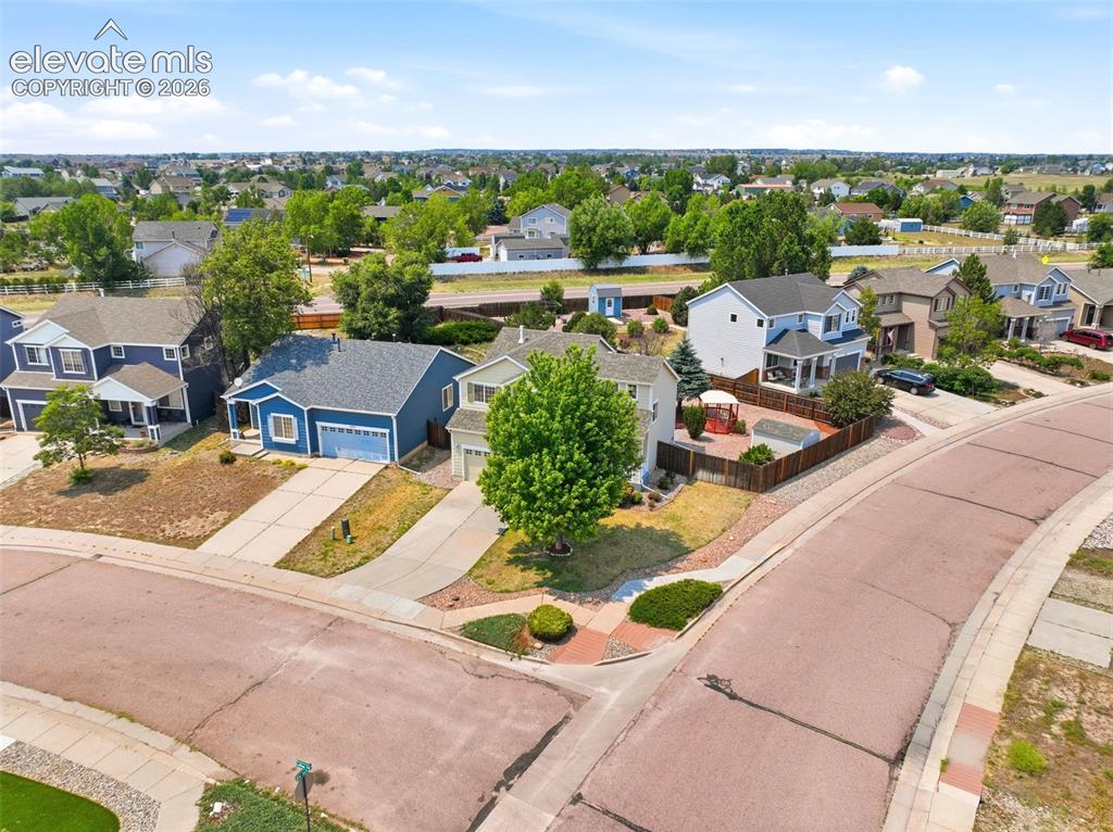 Image 46 of 48: Residential neighborhood featuring varied architectural styles and mature l