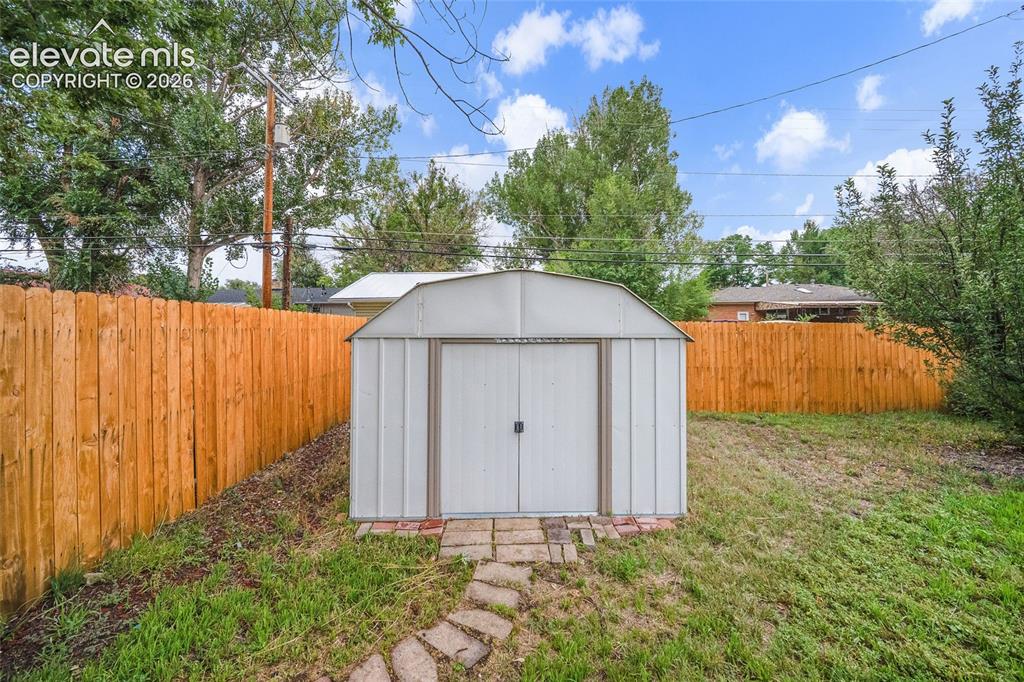 Image 37 of 43: Storage Shed stays with property. 