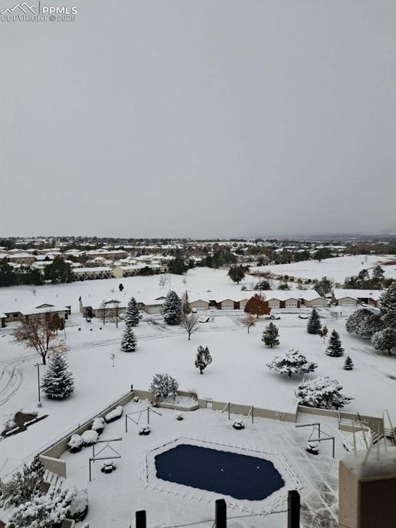 Image 24 of 25: View from the patio after a snow fall