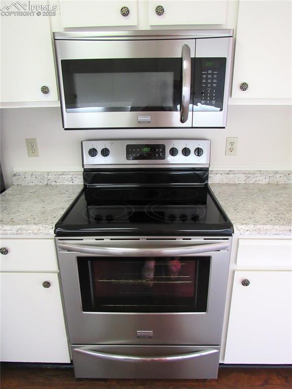 Image 9 of 25: Stainless steel stove and microwave