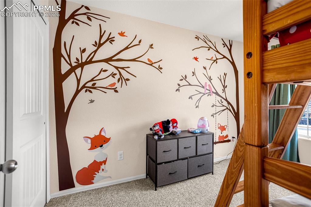 Image 14 of 30: Bedroom featuring light carpet and baseboards