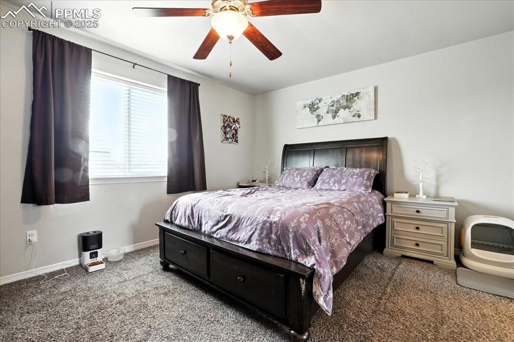 Image 11 of 31: Bedroom with carpet floors and a ceiling fan
