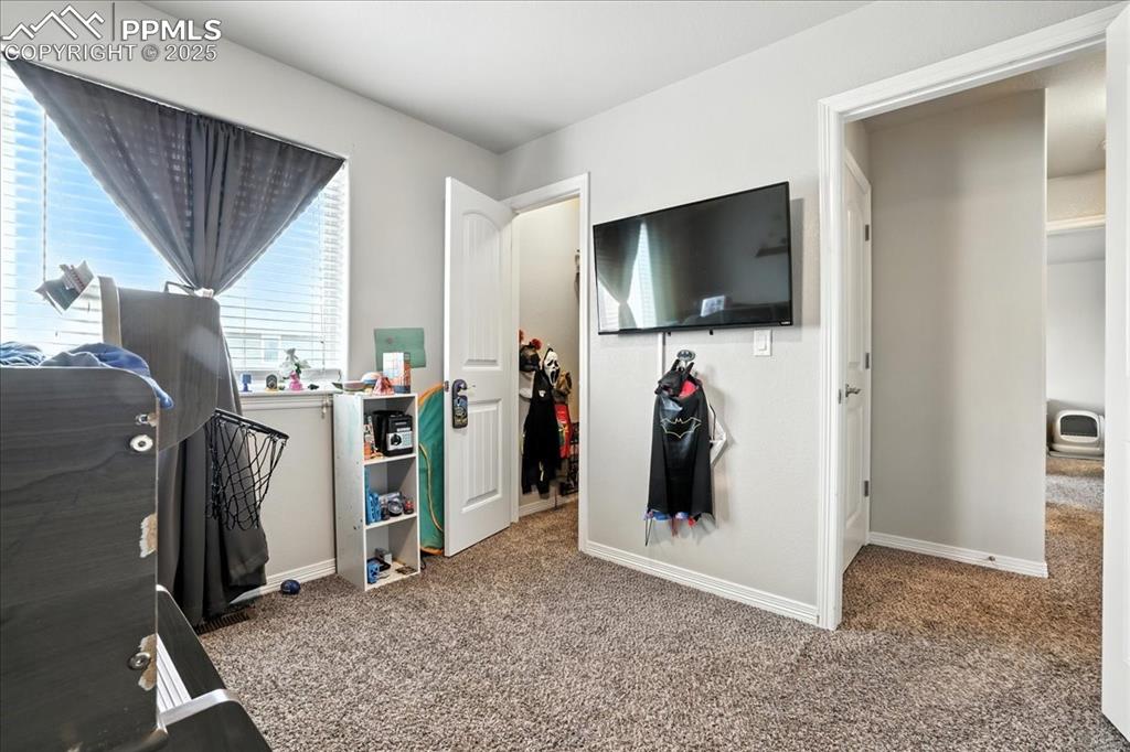 Image 14 of 31: Bedroom featuring carpet floors and baseboards