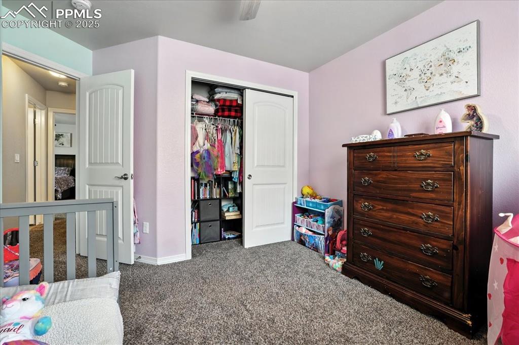 Image 16 of 31: Bedroom with carpet floors and a closet