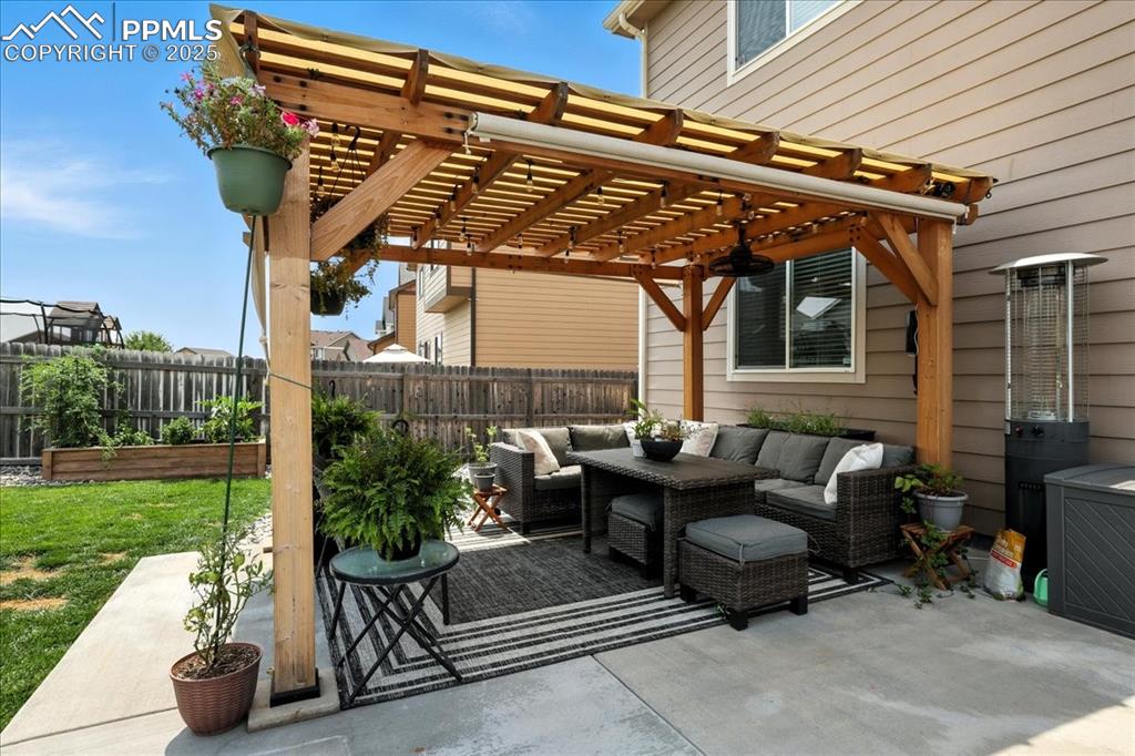 Image 3 of 31: Fenced backyard featuring a patio area, a pergola, and outdoor lounge area