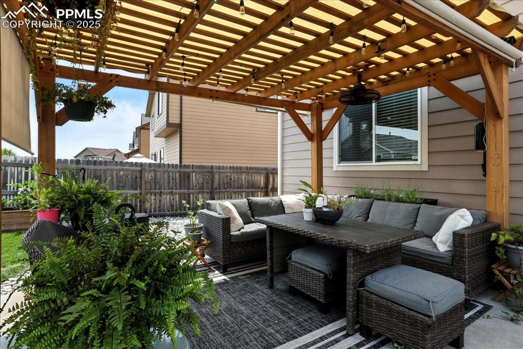 Image 30 of 31: View of patio / terrace featuring an outdoor living space and a pergola