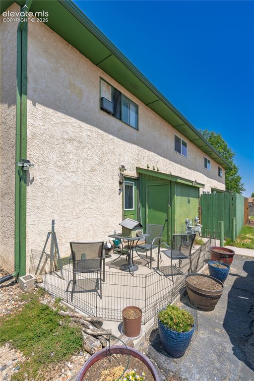Image 20 of 20: Rear Entry, Storage, Patio