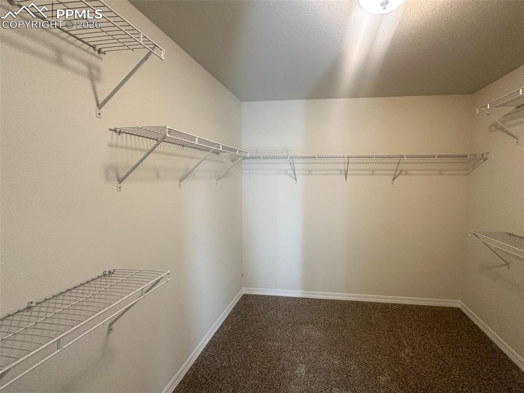 Image 17 of 34: Primary closet