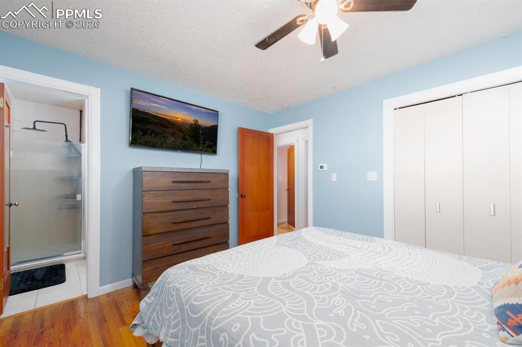 Image 19 of 34: Primary Bedroom and bathroom