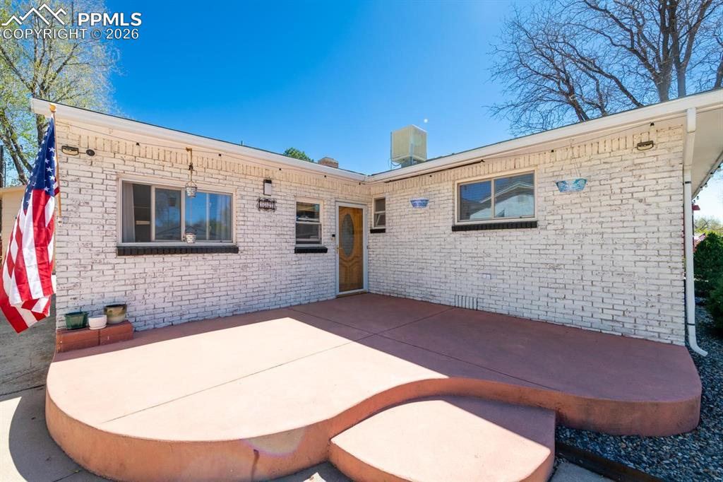 Image 3 of 34: Front door and patio