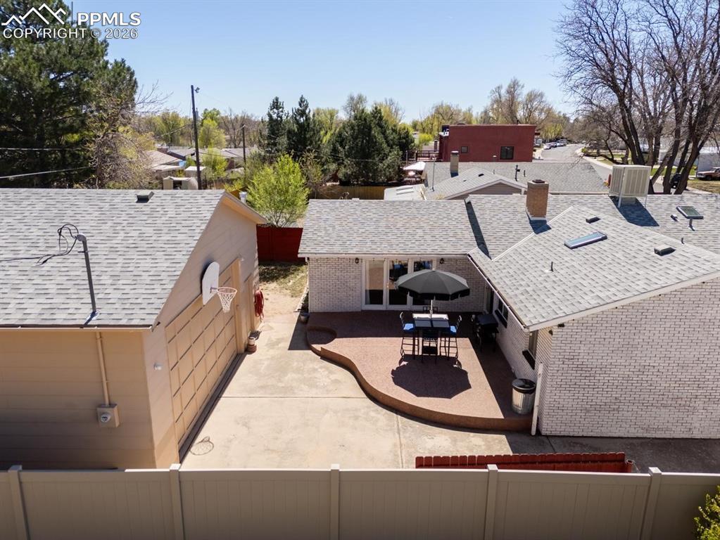 Image 31 of 34: Aerial view of backyard and vehicle gate