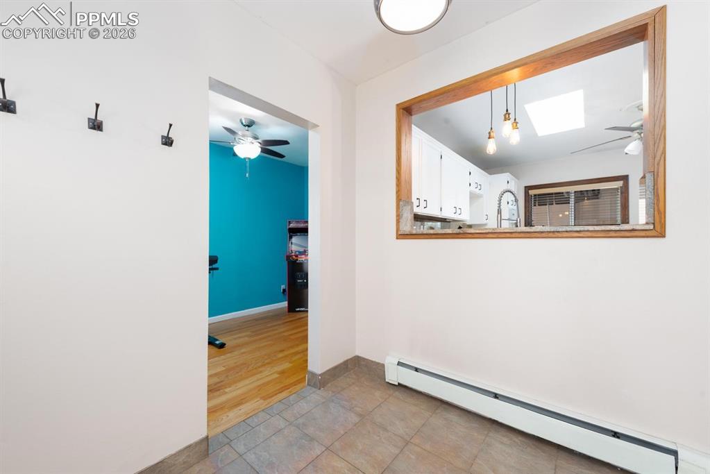 Image 5 of 34: Entryway that leads into the living areas, kitchen, and flex room