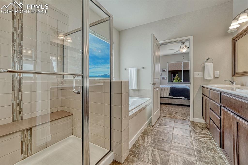 Image 10 of 46: Spa-like 5-piece bath with garden-view soaking tub