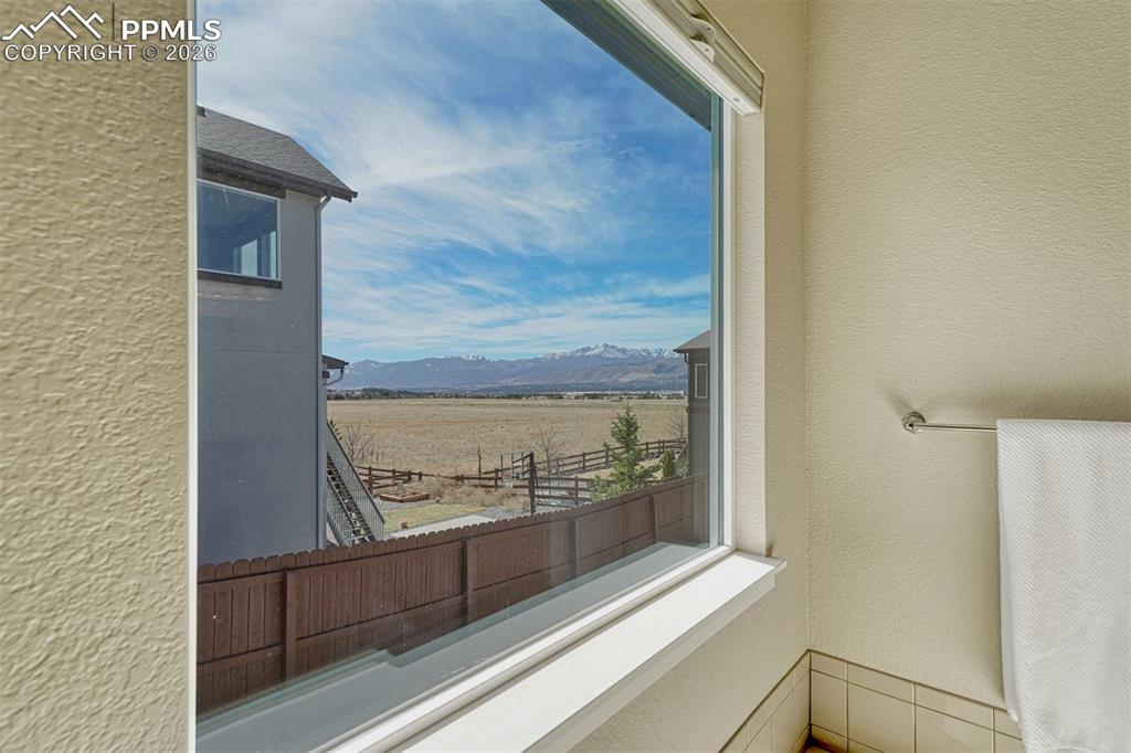 Image 11 of 46: Spa-like 5-piece bath with garden-view soaking tub