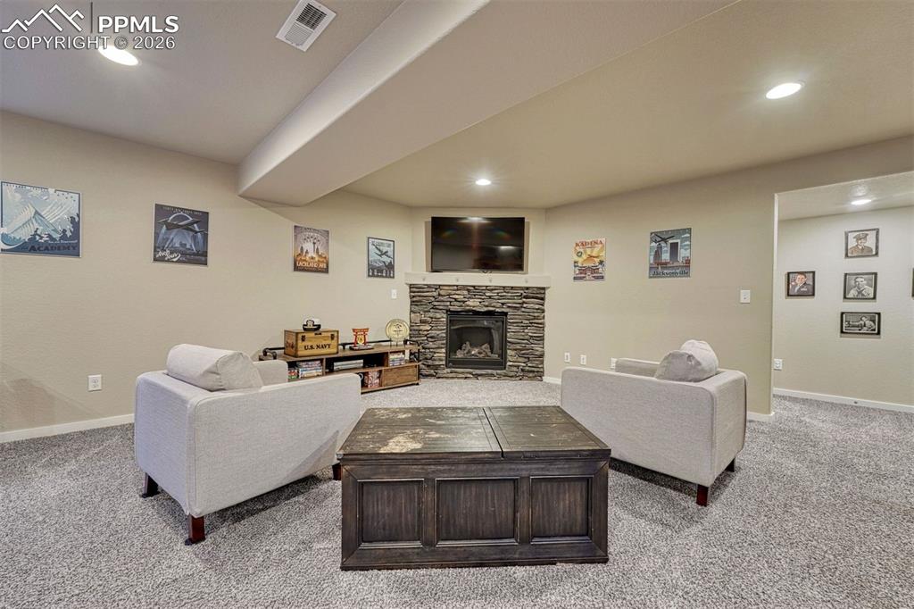 Image 19 of 46: Gas fireplace in the basement.