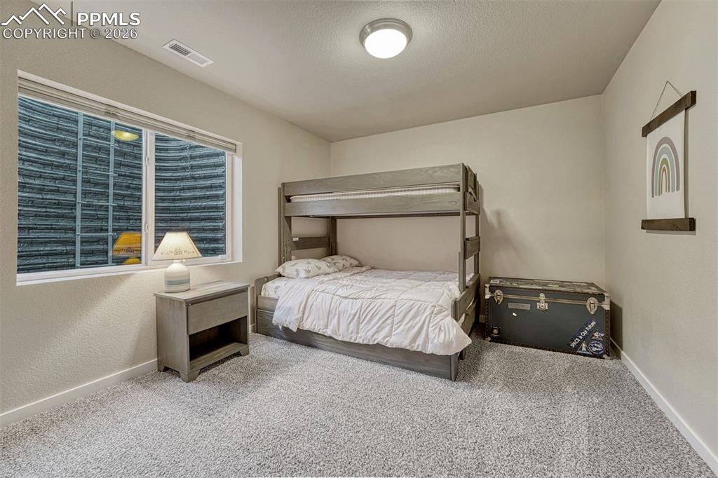 Image 28 of 46: Basement designed with higher ceilings for comfortable living