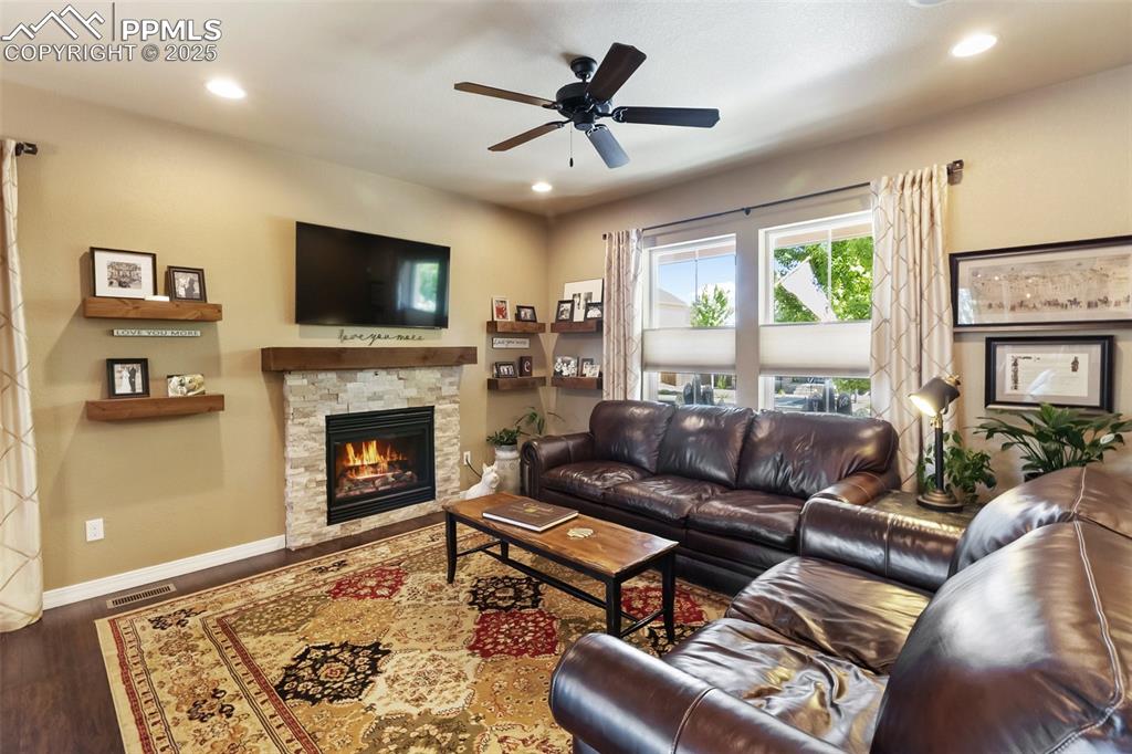 Image 12 of 50: Living room with wood finished floors, a ceiling fan, recessed lighting, an