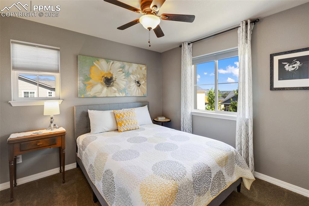 Image 29 of 50: Bedroom featuring carpet and ceiling fan
