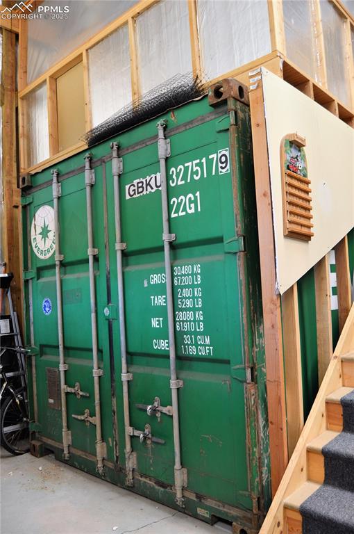 Image 45 of 50: Container Inside the 40x60 garage
