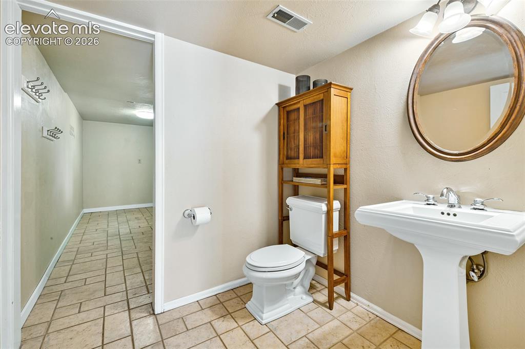Image 17 of 50: off powder room with pedestal sink