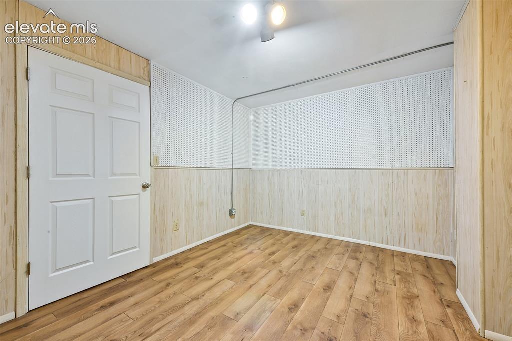 Image 32 of 50: Bonus room in the basement...craft room? workshop?