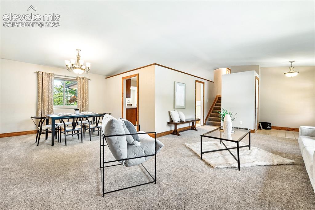 Image 6 of 50: Formal Living Room opens to formal Dining Room