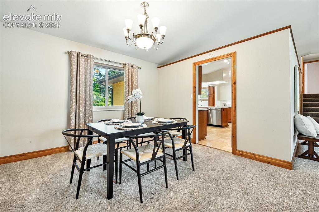 Image 7 of 50: Formal Dining with new carpet and paint with kitchen access